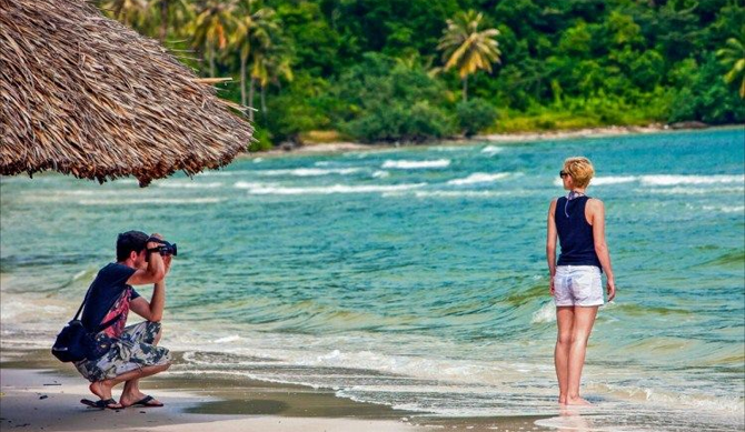 A couple is enjoying their honeymoon at Nha Trang Beach, Vietnam